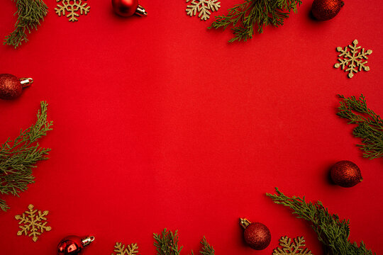 Christmas and Happy New year background with gold glitter decorations on red bright background. Holiday party decoration . Christmas celebration, holiday card