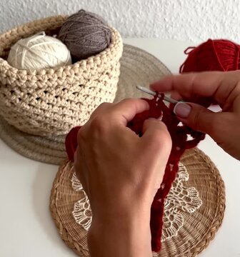 hands with knitting yarn