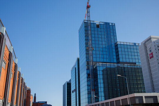 Poznan city center downtown at daytime in winter. Stary Browar mall, nearest Ibis hotel and skyscrapers. Everyday life at Greater Poland town on 4th of March, 2026 in Poznan, Poland