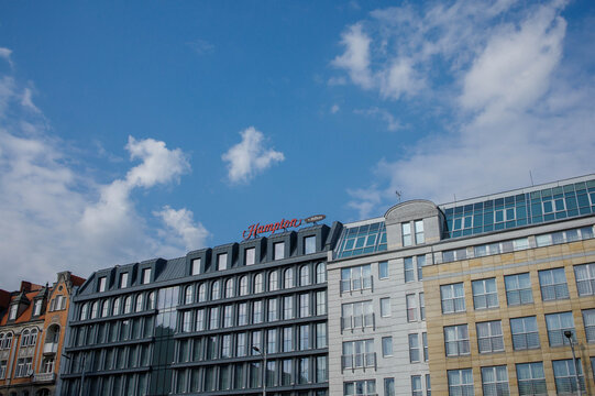 Hamptons by Hilton hotel building facade exterior in Poznan city downtown in Poland on a sunny day with clear sky on 23rd of March 2026 in Poznan, Poland