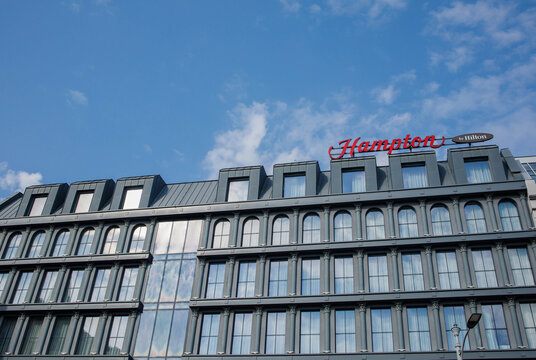 Hamptons by Hilton hotel building facade exterior in Poznan city downtown in Poland on a sunny day with clear sky on 23rd of March 2026 in Poznan, Poland