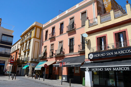 Old typical houses in San Marcos square , in the center of town of Seville city, Spain