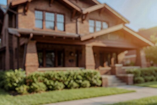 blurred view of a craftsman house exterior with front porch, perfect for use as a background image for website design, home improvement themes or advertising