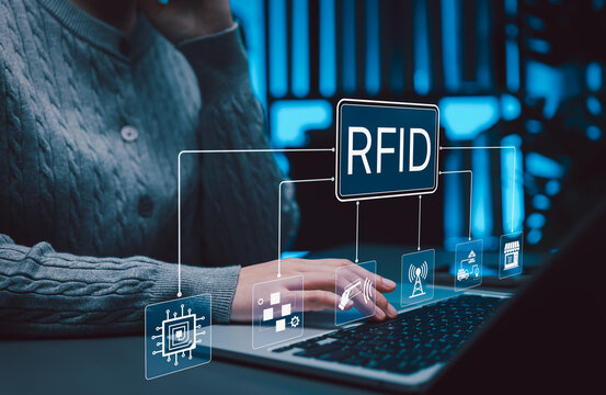 RFID technology connects contactless identification, inventory tracking, logistics, retail, automated data exchange. professional uses laptop to manage smart operation, assets, supply chain visibility