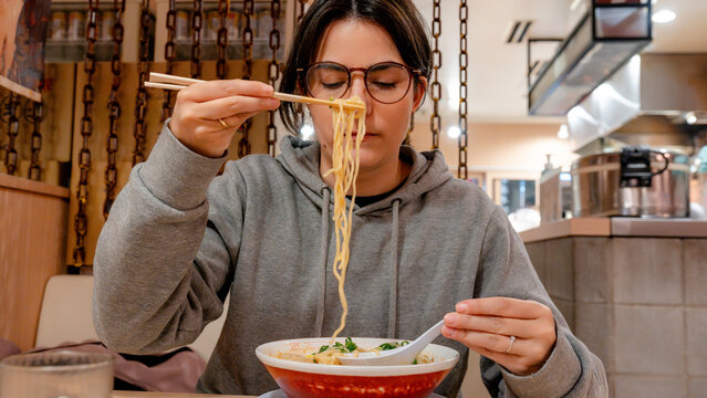 Enjoying ramen in a cozy Osaka restaurant