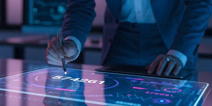 Person interacting with a futuristic holographic display showing data