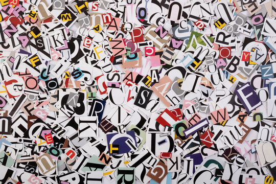 Pile of many colorful letters from newspapers and magazines