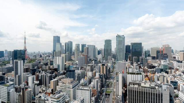 Tokyo Minato skyline with modern office towers and clouds