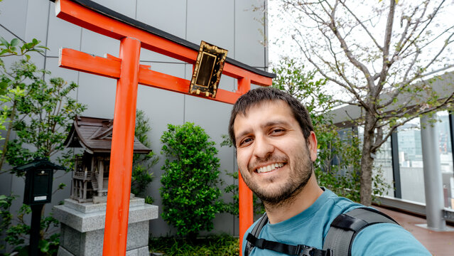 Selfie with a shrine torii gate in Ginza district, Tokyo
