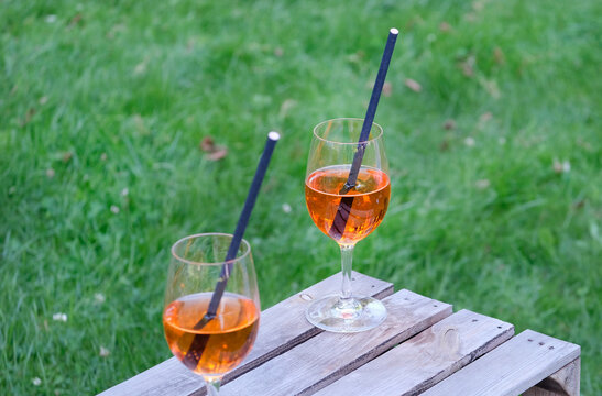 Two glasses of Aperol Spritz during a summer party