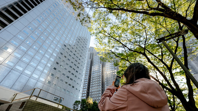 Tourist photographing Tokyo Metropolitan Government Building