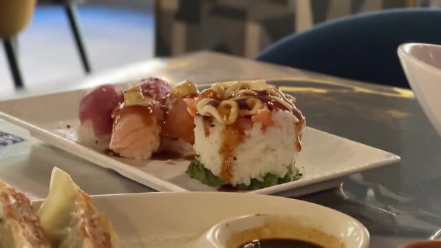 Sushi nigiri platter with tuna and salmon at a restaurant