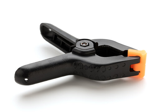 A clamp for fastening an object, whitewashed on a white background. A clamp for connecting parts.