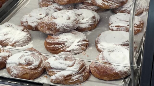 Pecan pastries glazed on a bakery tray