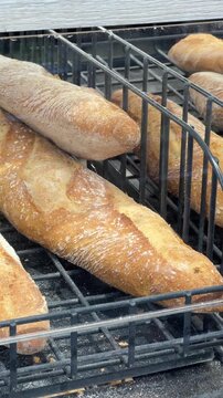 Fresh baguettes displayed in a bakery basket