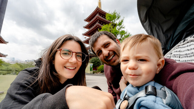 Family photo with Senso-ji Temple in the background