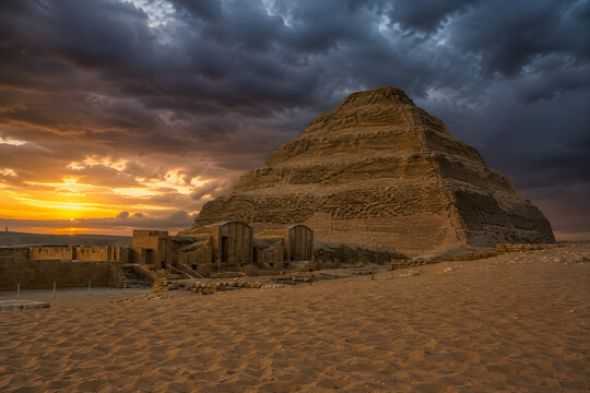 Step Pyramid of Djoser at Saqqara in evening dramatic sky, oldest Egypt pyramid