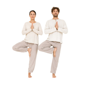 A female and male practicing yoga on tree pose isolated on transparent background PNG element