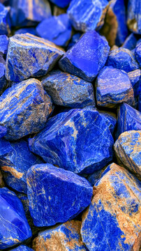 Lapis lazuli stones displaying deep blue color and rough texture