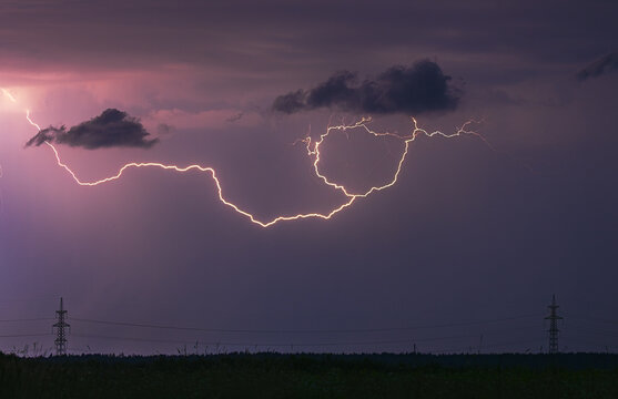Storm, lightning strike in the horizon, thunder concept