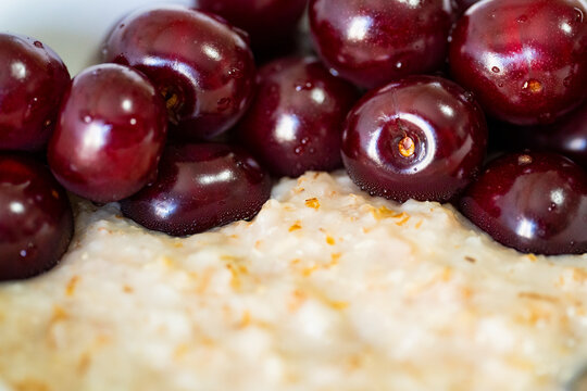 Oatmeal Porridge with Fresh Sweet Cherries in Bowl