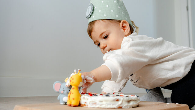 Baby celebrates first birthday with smash cake fun