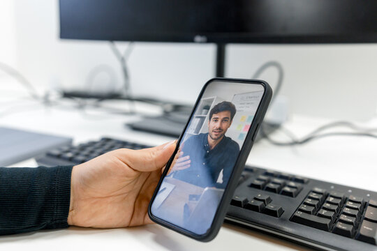 MBA student attending online business class on smartphone
