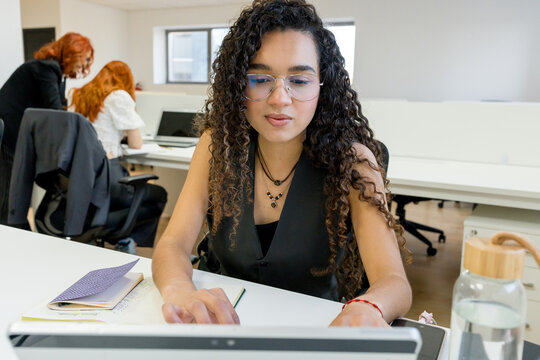 MBA student study at laptop in modern classroom