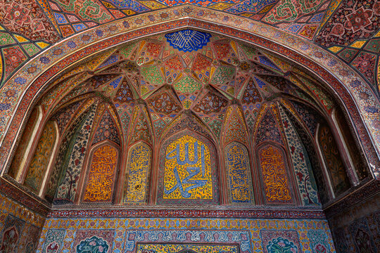 View of the intricate tile work and Islamic calligraphy adorning the interior walls and ceiling of the Wazir Khan Mosque in Lahore, Punjab, Pakistan.