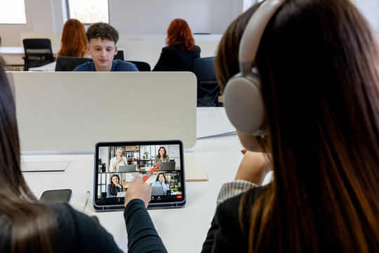 MBA student attend virtual class in modern study room