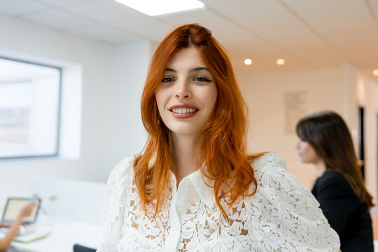 Smiling MBA student in a modern business classroom