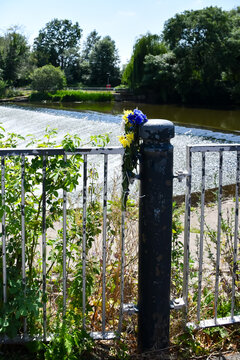 Take care near water. Flowers placed near the weir in Shrewsbury in memorial for someone who drown. Water claims many life&rsquo;s in summer as people enter the water and get into difficultly.