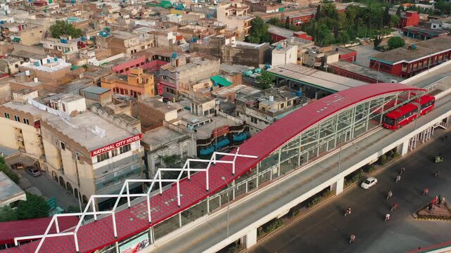 Aerial view of metro bus station with elevated corridor in city