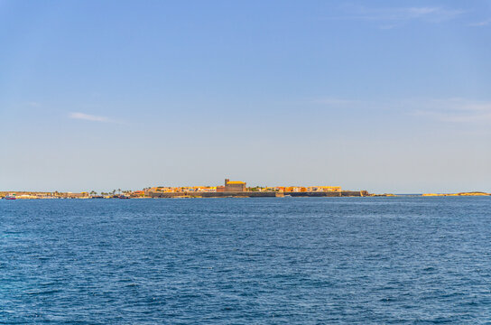 Tabarca Island Nueva Tabarca Isla Plana panoramic view with buildings in village town in Mediterranean Sea water in sunny summer day with blue sky, Alicante province, Valencian Community, Spain