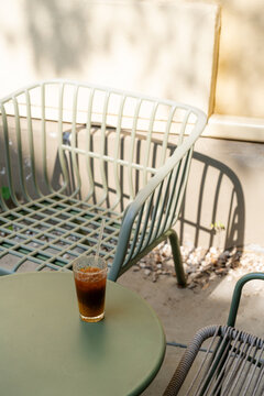 High angle view of iced bumble coffee on an empty patio table