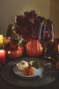 Thanksgiving Table Setting With Mini Pumpkins And Wine Glass Ready For Dinner