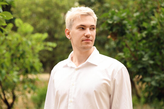 Handsome man wearing white shirt in park
