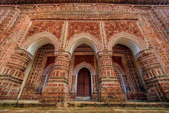 View of the intricate terracotta carvings and arched entrances of the historic Kantajew Temple in Dinajpur District, Rangpur Division, Bangladesh.