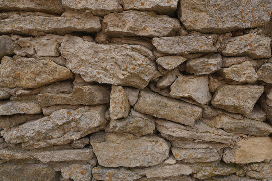 Rustic Earth Tones Stone Wall Texture Background - Natural Rough Weathered Surface for Architecture Design Projects Microstock Asset
