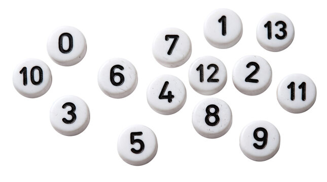 Scattered white plastic numbered beads with black digits on a transparent background