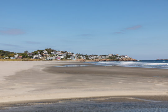 beautiful beach near Gloucester with traditional wooden houses