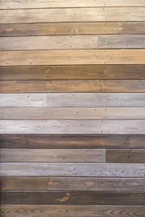 Horizontal wooden plank wall with mixed tones and visible grain © Evgeniia Biriukova