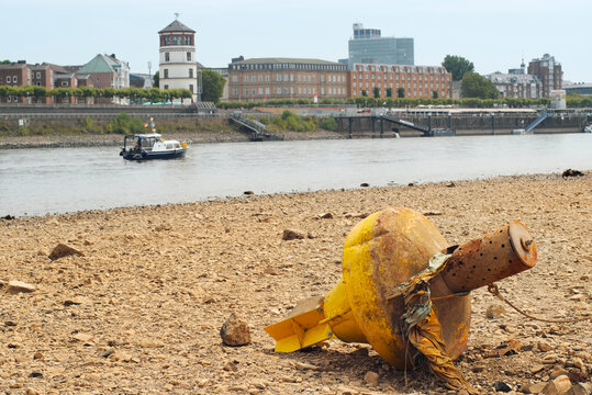 D&uuml;sseldorf, Germany ,low stream gauge of rhine river.Water shortage, environmental catastrophe, climate change,global warming concept. Due to the drought buoys are on dry land.