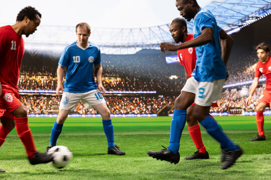 Soccer players in red and blue jerseys contest possession on the pitch, combining fast dribbling and footwork as defenders protect the goal.