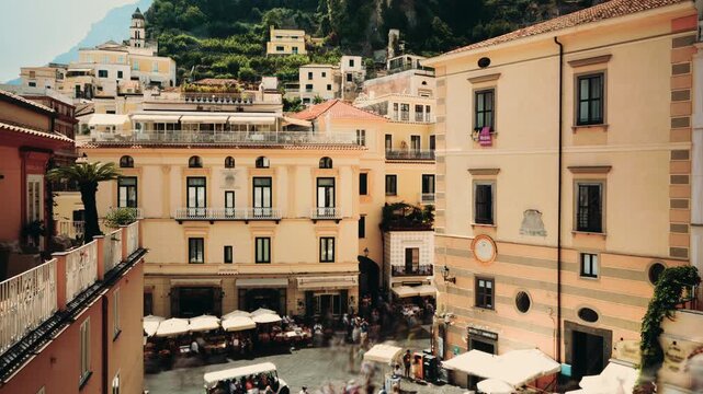 Amalfi town, main square, buildings, and tourists in summer