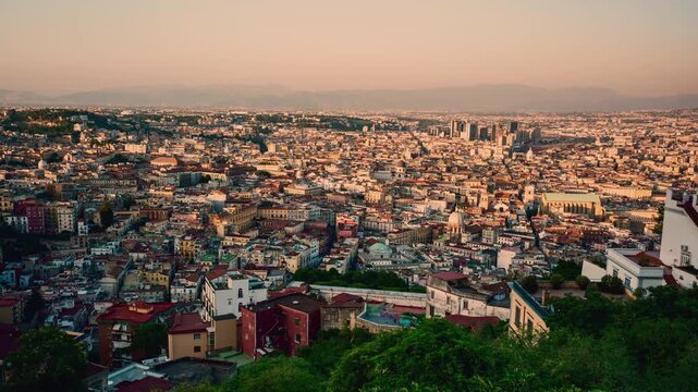 Aerial time lapse of Naples at sunset with typical buildings
