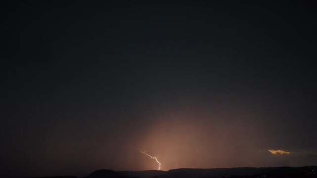 Dramatic real lightning in the night sky during a thunderstorm Summer