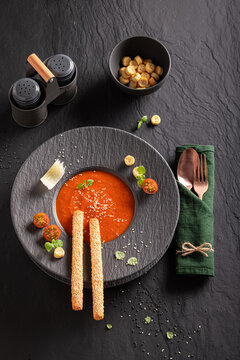 Exclusive and aromatic tomato soup as sophisticated food in restaurant.