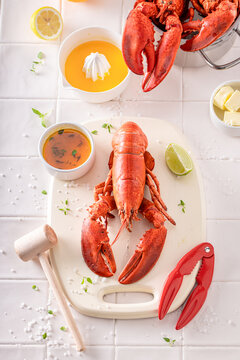 Cooked and tasty lobster with orange butter sauce.