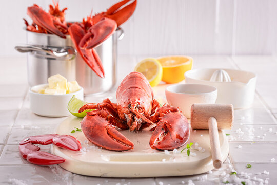 Cooked and tasty lobster with hammer and splitting tongs.